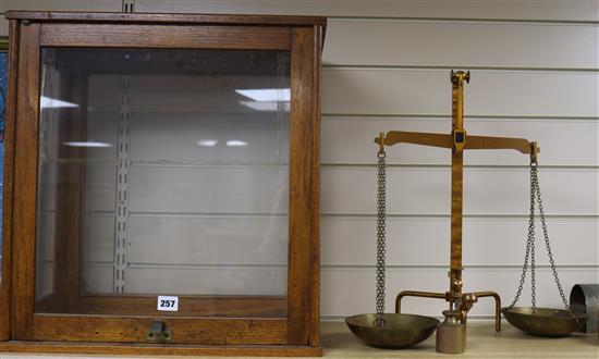 A cased set of chemist scales and weights